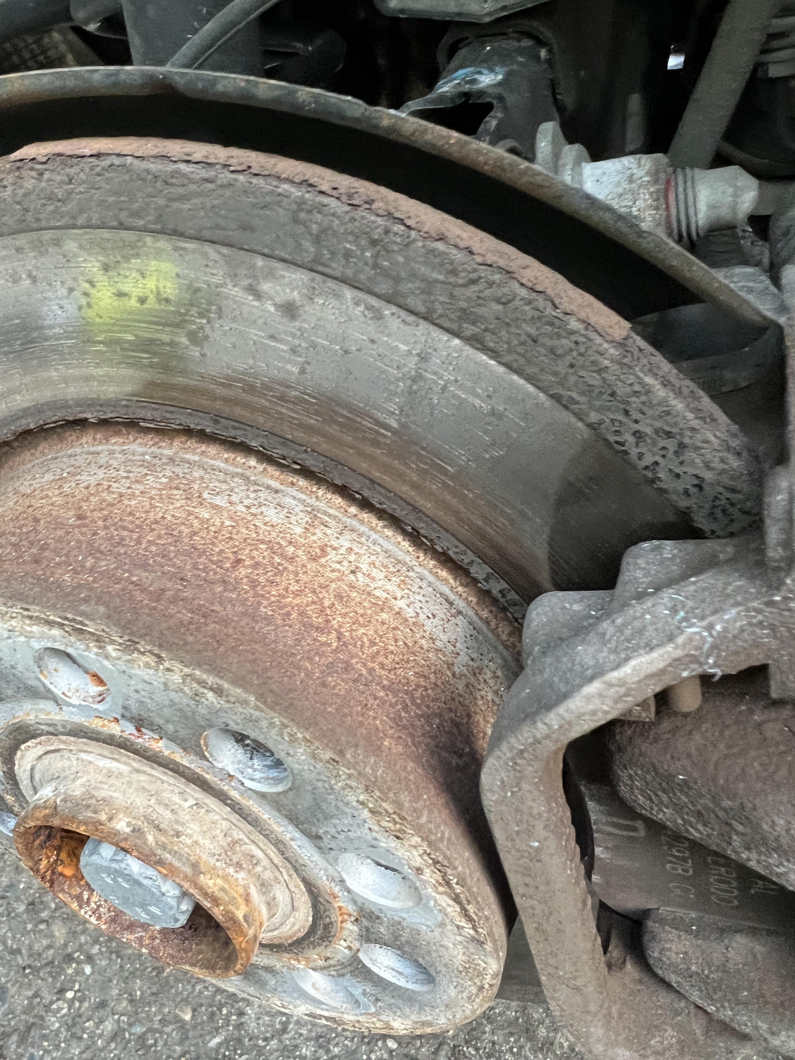 Vehicle undergoing a brake inspection