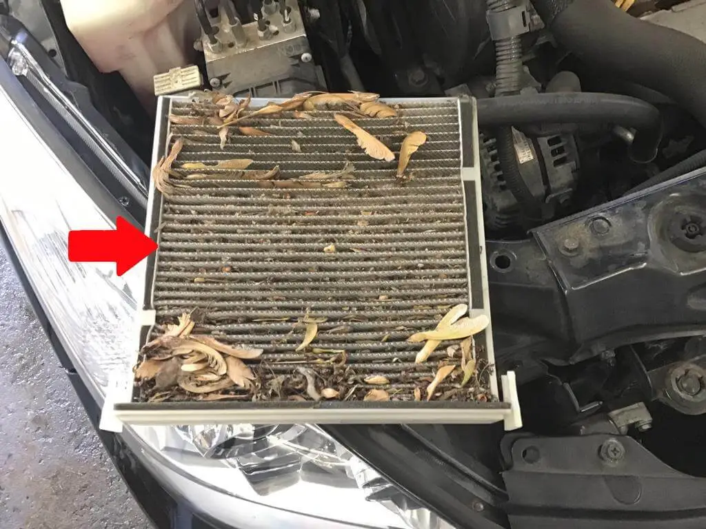 Cabin air filter being replaced