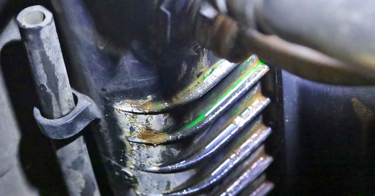 Vehicle cooling system being inspected for a leak