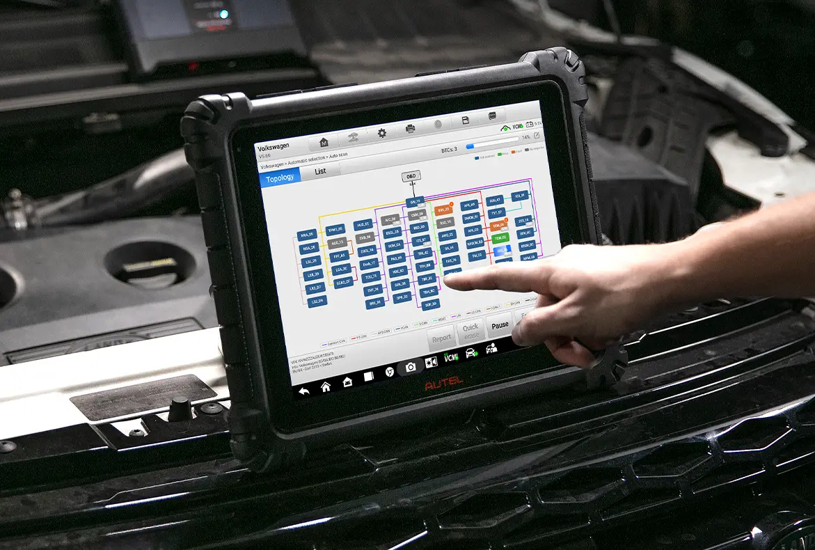 Technician performing a vehicle diagnostic scan